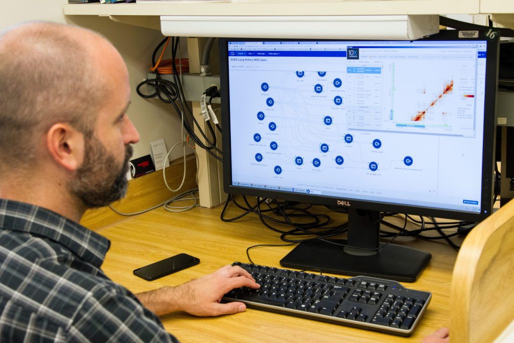 Man looking at computer program thinking it's time to replace their ERP System