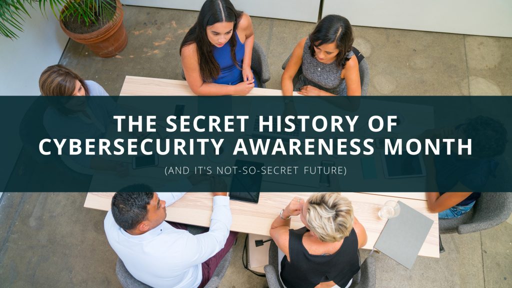 coworkers around a desk cybersecurity awareness month banner